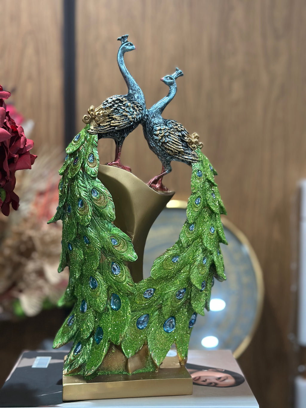 Two Peacocks facing each other